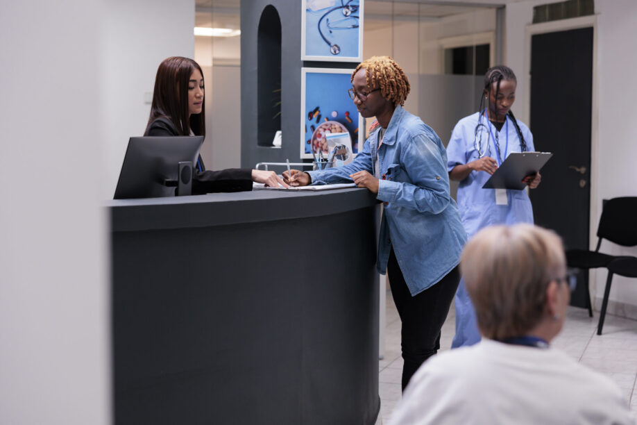African american patient filling in report papers