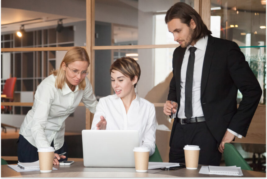 business-partners-negotiating-about-strategies-using-laptop